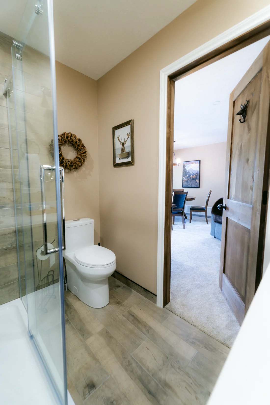 A lodge ensuite opening onto a bedroom with a chair