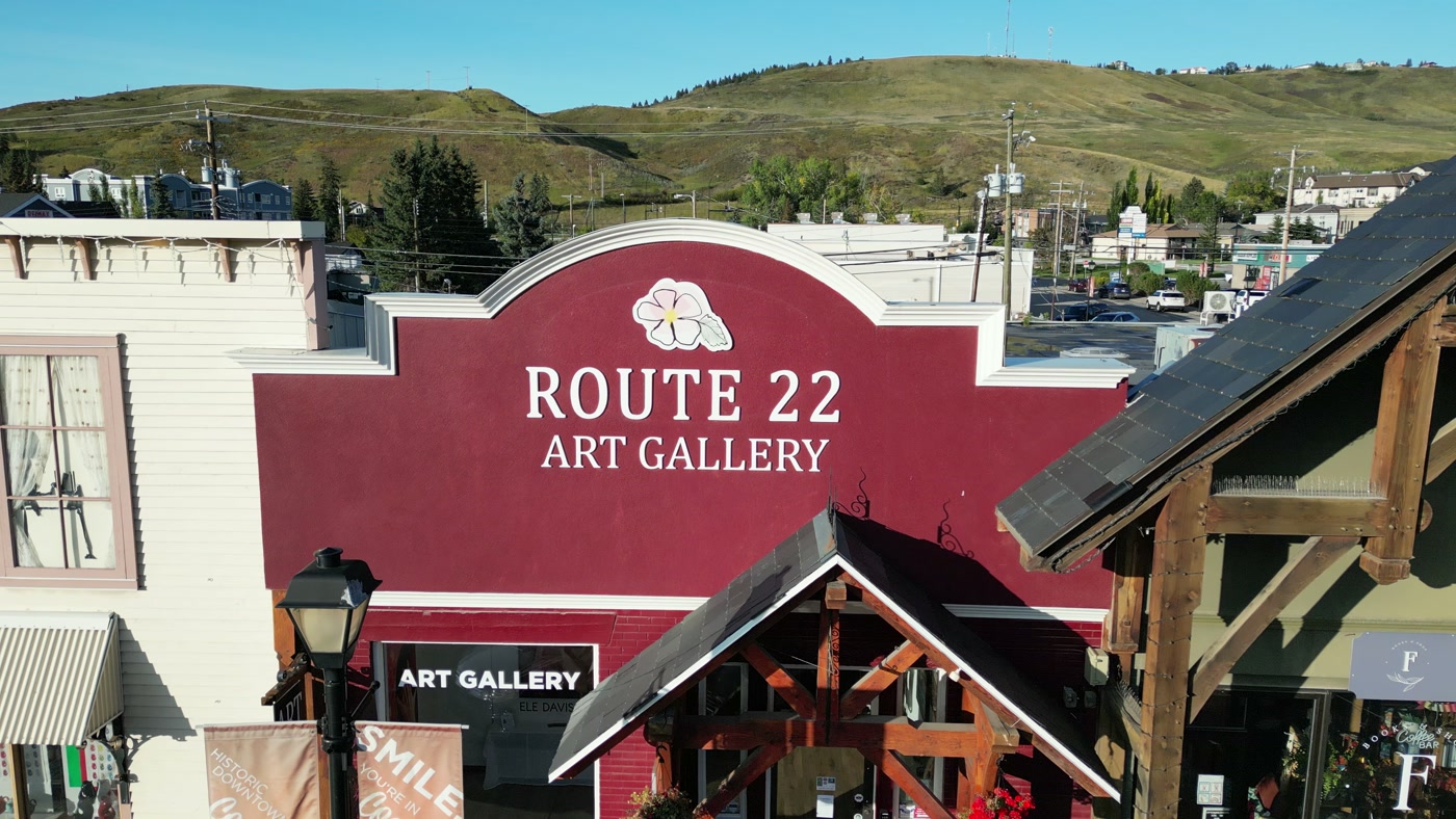 ROUTE 22 ART GALLERY painted in white on the deep red parapet, a blossom above the name