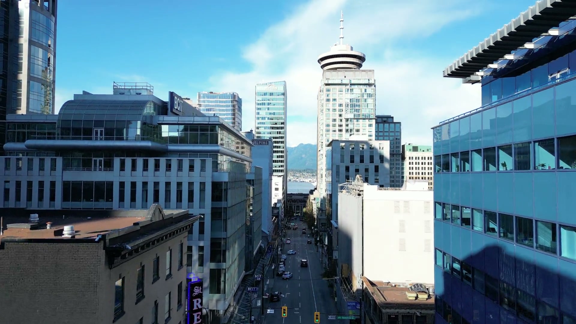 Past the parking skybridge and on up Seymour Street, rising until Harbour Centre's Lookout, the harbour water and the North Shore mountains close the end of the street, BCIT's sign on the left