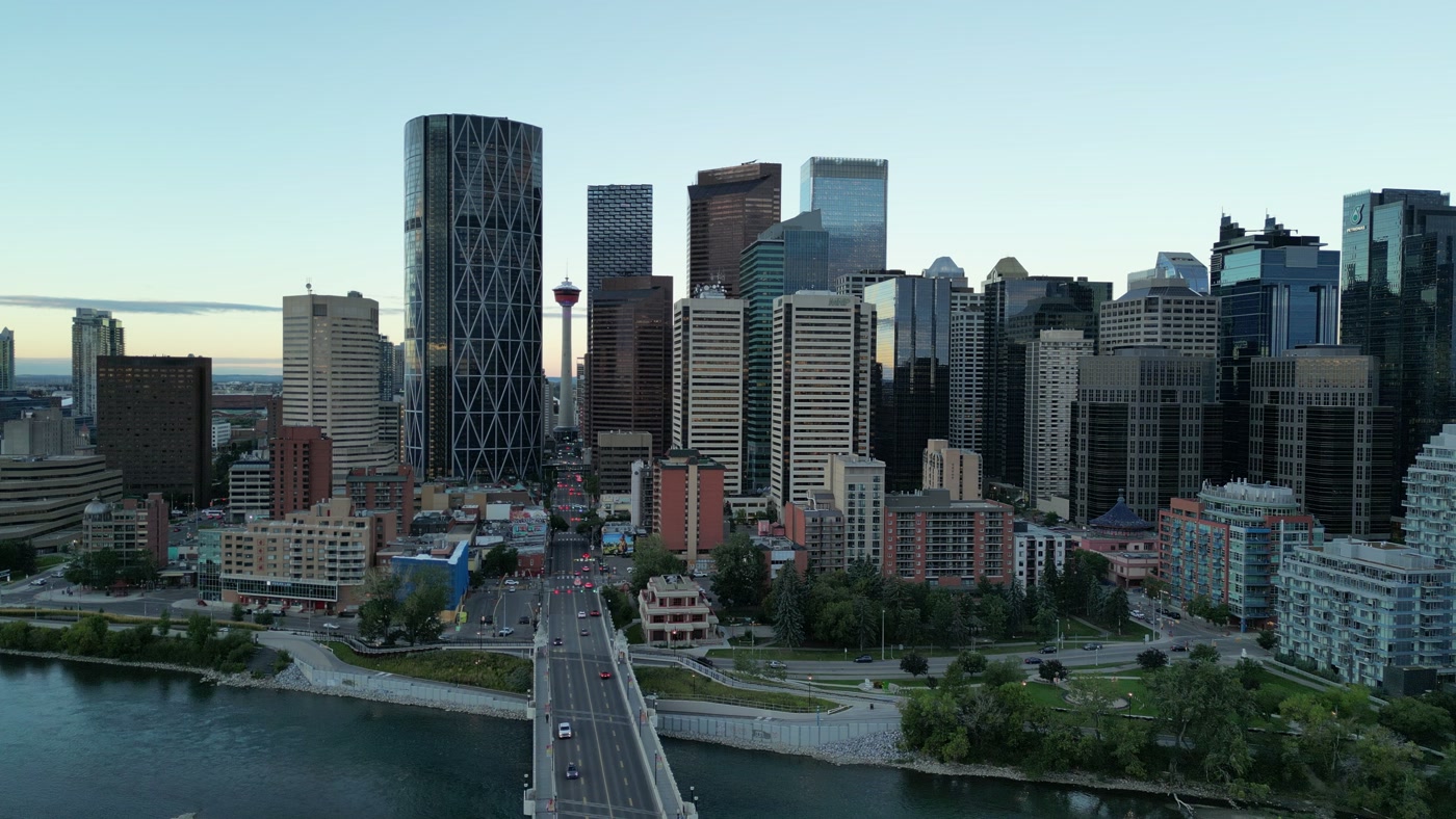 The deck of the Centre Street Bridge from above, Chinatown's rooftops at its south end and the Calgary Tower straight ahead down Centre Street